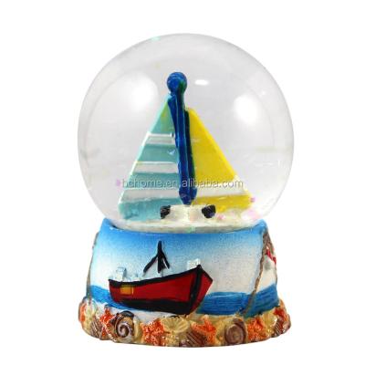 China Custom Europe Resin Christmas Snow Globe With Ship for sale