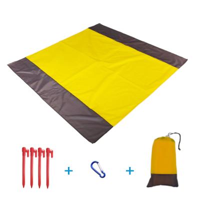 China Fold In One Outdoor Wholesale Beach Blanket Waterproof Camping Matte Bag Sand Beach Pocket Foldable Blanket for sale