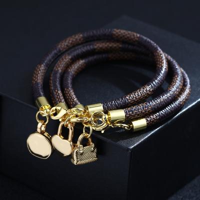 China New fashion stripe casual/sporty bracelet bag pendant plated real gold bracelet manufacturers wholesale for sale