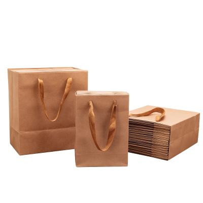 China Recyclable Wholesale Custom Printed Christmas Gift Food Craft Shopping Bag Brown Kraft Paper Bag With Handles for sale