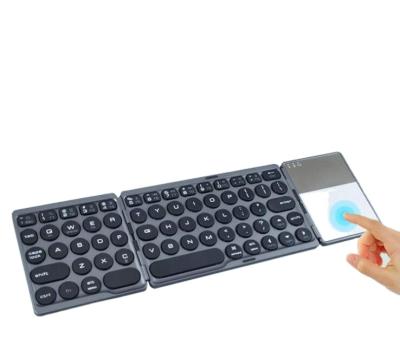 China Ultra Thin Foldable Touchpad Radio Keyboard Mini Keyboard Support Windows Android IOS Rechargeable Tablet PC for sale