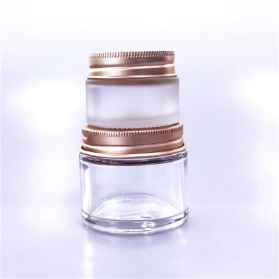 China Eco-friendly 60ml Amber Clear Glass Jar Bottles Recyclable Containers Cream To Scrub Jar With Metal Lid 60g Aluminum Cosmetic Glass Jar for sale