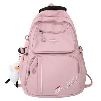 China Large Capacity Primary School Backpack Light Solid Color Backpack Waterproof Student Schoolbag for sale