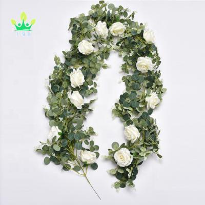 China Natural Touch Artificial Flower Eucalyptus Garland with 12 Camellias Rose Vine Silk Decorations for sale