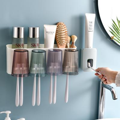 China Wall Mounted Lazy Toothbrush Toilet Squeeze Cup Holder Automatic Squeeze Toothpaste Holder Punch Free Lazy Suit for sale