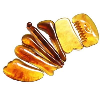 China Face Roller Tendon Facial Stick Lymphatic Massage Tools Natural Resin Amber 7 Pcs Acupuncture Gua Sha Scraper Set Roller Face Massager Tool Good Quality for sale