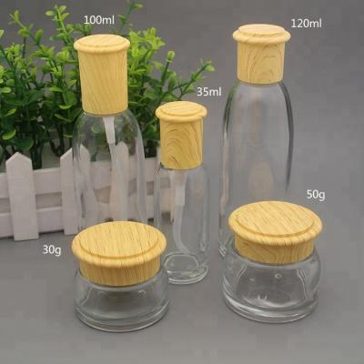 China 30g 50g 35ml 100ml 120ml Clear Round Personal Care Cream Jar Skin Care Water Lotion Glass Cosmetic Bottle With Plastic Cap for sale