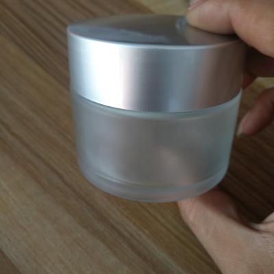 China Personal Care 5g 10g 15g 20g 30g 50g 60g 100g Personal Care Frosted Clear Round Glass Eye Face Cream Jar With Frosted Light Silver Cap for sale