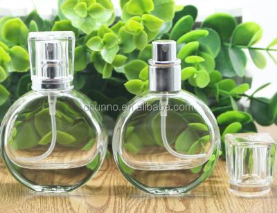 China Glass Personal Care 25ml Empty Perfume Bottles With Gold Or Silver Sprayer for sale