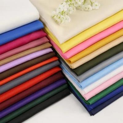 China 100 Soft Waterproof 190T 210T Textile Price Waterproof Silk Plain Lining Taffeta Polyester Fabric for sale