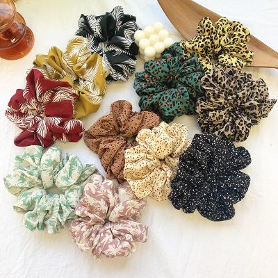 China Hair Tie Hair Accessories Customize About Patterns And Leopard Printed Above Waist Hair Scrunchies for sale