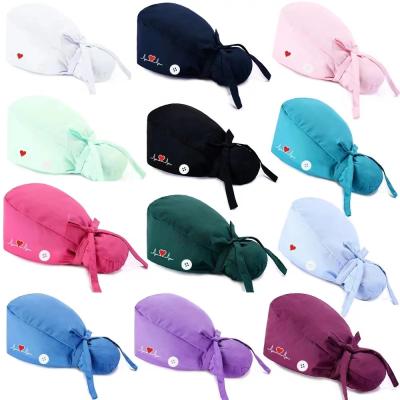 China Solid Color Eco-Friendly Women Nurse Cap ECG Custom Logo Ponytail Scrub Hats With Buttons for sale