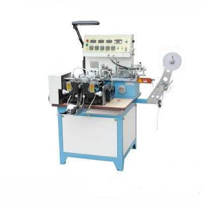 China Multifunction Woven Label Cut and Fold Machine JZ2817/ Garment Wash Care Satin Ribbon Label Cutting Machine Price Te koop