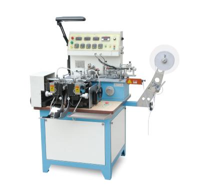 Cina JZ-2817 Automatic Woven Label Edge Cut and Fold Machine for Polyester Satin Ribbon, Cotton Tape and Nylon Taffeta in vendita