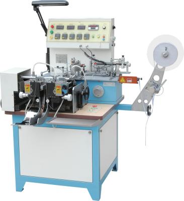 Cina JZ-2817 Jingda Garment Satin Care Label Cutting and Folding Machine for Cotton Tape, Nylon Taffeta , center fold & mitre in vendita