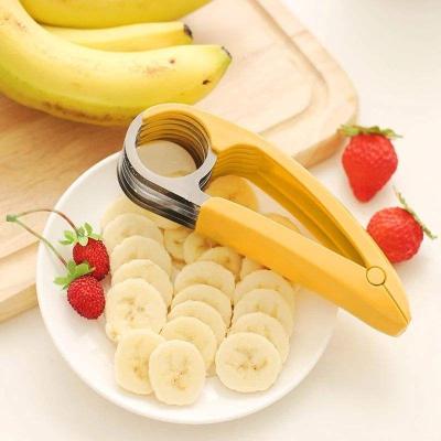 China Sustainable Stainless steel banana cut household stainless steel fruit slicer plastic handle banana cucumber ham sausage slicer for sale