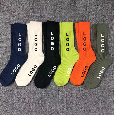 China QUICK DRY custom made black and white cotton logo crew socks sports socks for men for sale