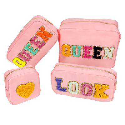 China New Fashion Stock Customizable Durable Waterproof Cosmetic Bag Nylon Logo Letter Large Capacity Patch Custom Makeup Bag for sale