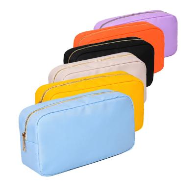 China Fashion Stock Small Size Multi Color Premium Nylon Waterproof Travel Accessories Organizer For Girls Women Mini Cosmetic Bag for sale