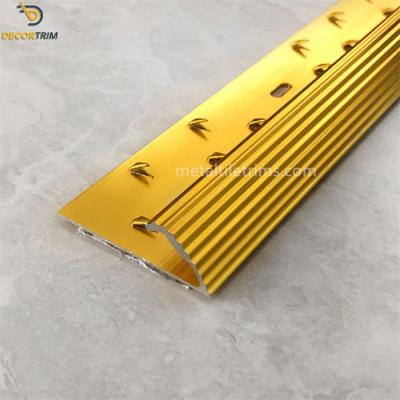 China Carpet Edge Trim Carpet Transition Strip Gold 7.7mm×38mm Gripper Punching for sale