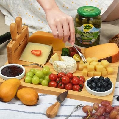 China Sustainable bamboo cheese board cutlery set with slate cheese board with serving dish and tool holder, include 4 cheese knives for sale