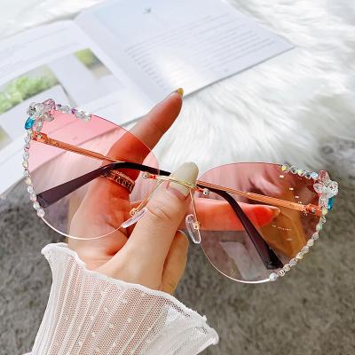 China Luxury Rimless Sun Glasses Women Cat Eye Handmade Rhinestone Sunglasses UV400 Cat Eye Sunglass Vintage Oculos Gafas 2021 De Sol Mujer for sale