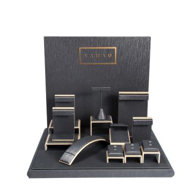 China Yadao Noble And Elegant Wholesale Wooden Jewelry Display Set Jewelry Display Coated With PU Leather for sale