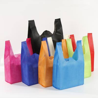 China Wenzhou PP Handled Biodegradable Recycled Reusable Non Woven T-shirt Bag Vest Handle Packaging Grocery Bag for sale