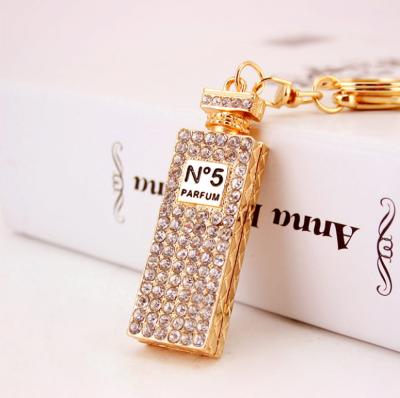 China Luxury Rhinestone Metal Bottle Perfume Key Chains Fashion Key Chain For Women Handbag Decoration Accessories for sale