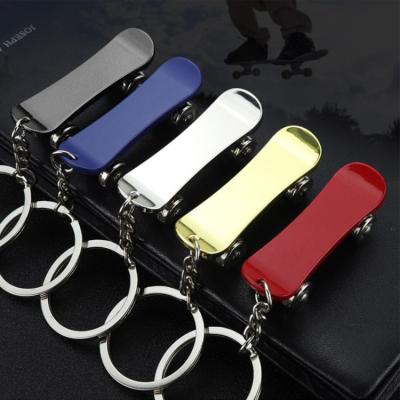 China Metal Fashion Sports Mini Skateboard Alloy 3D Scooter Key Chain For Kids for sale