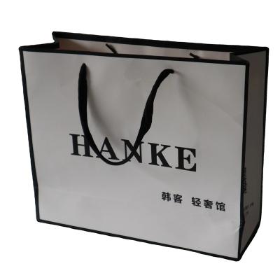 China Recyclable Custom Luxury Food Kraft Packaging Gift Shopping Paper Bags For Clothes for sale