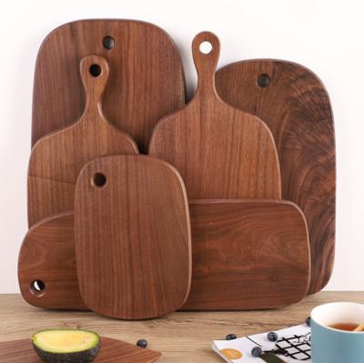 China Wooden Dish Designs Cheese/Pizaa/Charcuterie Hot Sleek Sleek Walnut Cutting Board Panel Houses Wall Decor for sale