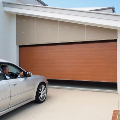 China Luxurious automatic sectional sliding garage door in oak wood gold color high quality anti-theft for sale