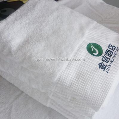 China Compressed 100% Cotton Hotel Towel Custom White With Embroidery Logo for sale