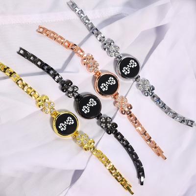 China Korean Version Four-leaf Clover Day/Date Simple Strap Women's Fashion Alloy Electronic Watches Diamond-studded Women's LED Digital Watch for sale