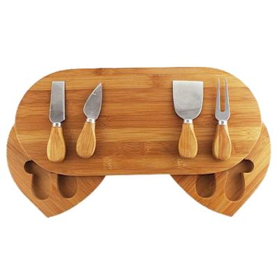 China Hidden Bamboo Oval Chopper Two Drawers Storage Cheese Board Workable With Serving Utensils Set for sale