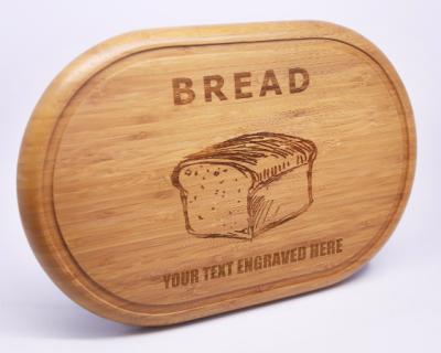 China Wholesale Personalized Engraved Eco-Friendly Sustainable Birthday Gift Large Oval Wooden Bamboo Bread Cutting Cutting Board for sale