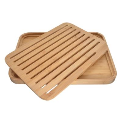 China Sustainable Natural Bamboo Bread Cutting Board Bamboo Bread Slicer Cook Tool With Removable Crumb Catcher for sale