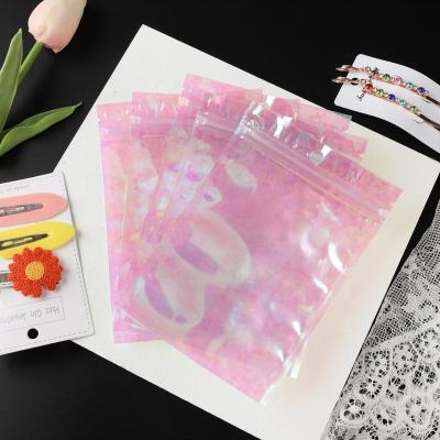 China Manufacturing Recyclable In Stock Rainbow Laser Bags Hologram Bags Pink Plastic Bags for sale