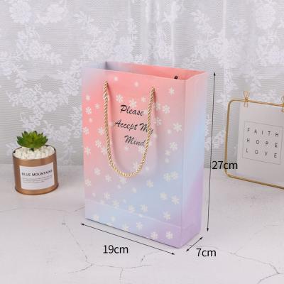 China Recyclable Hot Sale Apparel Gift Wedding Packaging Printing Logo Paper Bag Custom Drawstring Luxury Shopping for sale