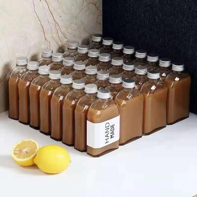 China Clear Flat Beverage Juice Cold Brew Coffee Glass Flask Bottles Design for sale