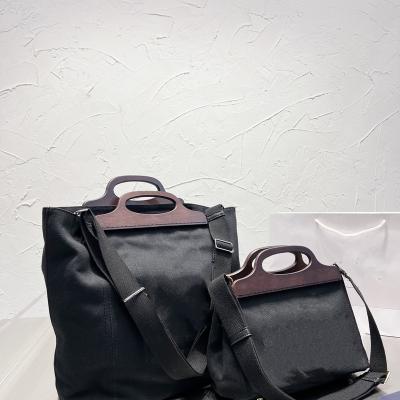 China Fashion Latest 22 Canvas Handbag Straddle Bag Leisure One Shoulder Business Briefcase High End Brand for sale