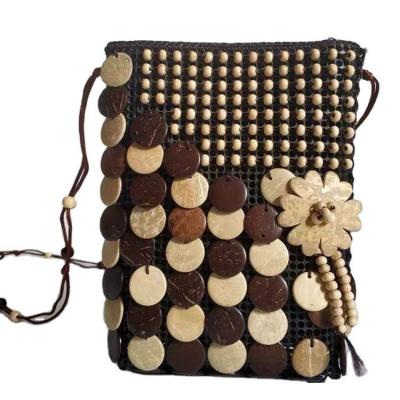 China PP color cell phone bag white coffee hook large coconut shell side string beads national wind tourist sector cell phone bag wholesa for sale