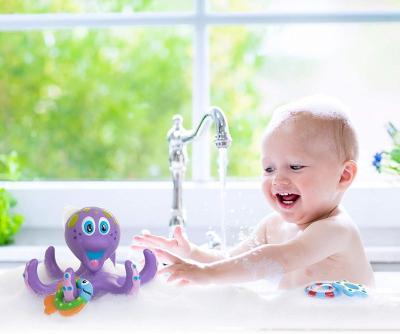 China Soft Floating Purple Octopus With 3 Flapping Rings Bath Toy Squirt Toy Bathtub Interactive Animal Evade Glue Water Bath Toys for sale