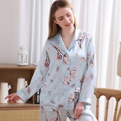 China QUICK DRY 100% thin spring and mulberry women's silk pajamas summer new style printing long-sleeved pants Lapel silk homewear for sale