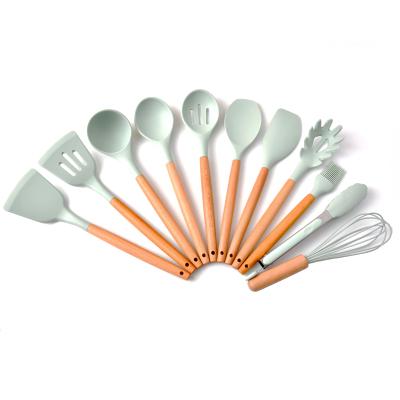 China Sustainable Food Grade Silicone Non-Stick Cookware Set With Wooden Handle And Storage Rack Kitchen Cooking Instruments for sale