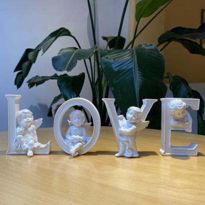 China Pure White LOVE LETTER HOME DECOR Resin Love Sculpture Home Decor Set of 4 Angel Cherub Statue Figurine Heart for sale