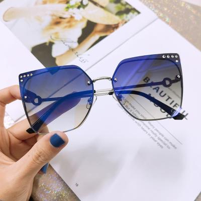 China Trendy Rimless Metal Rhinestone Women's Sun Glasses K34166 Trendy Sunglasses for sale