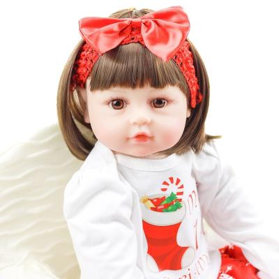 China Changeable Clothing Lifelike Soft Cuddly Weighted Cotton Cloth Body Vinyl Doll 24 Inch Custom Manufacturer for sale