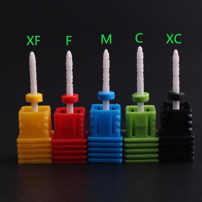 China Rocket Shape Ceramic Nail Drill Ceramic Cuspidal Bite Callus Removal Manicure Nail Drill Bit Burrs for sale